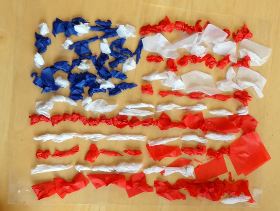 Sticky paper American flag craft - place crumpled tissue paper squares on contact paper to make this American flag sensory craft || Gift of Curiosity