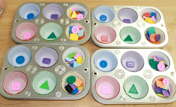 Sort shape buttons into muffin tins like Mom to 2 Posh Lil Divas