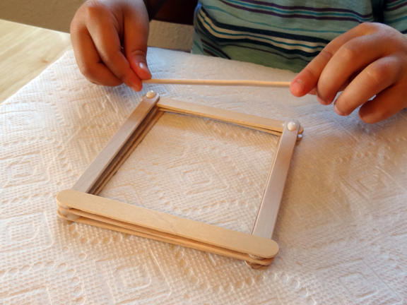 Build an animal pen from craft sticks for a fall on the farm sensory bin || Gift of Curiosity