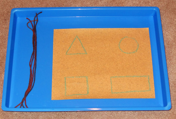 Montessori trays and activities - Tracing shapes on sandpaper using yarn || Gift of Curiosity