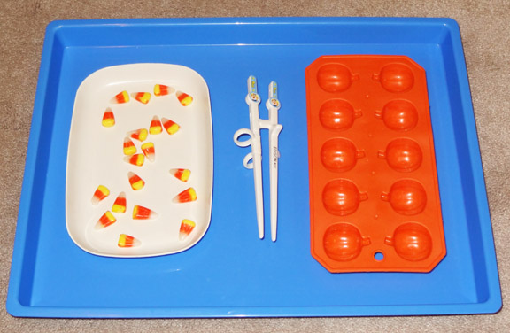Halloween Montessori activities: Using chopsticks to transfer candy corn || Gift of Curiosity