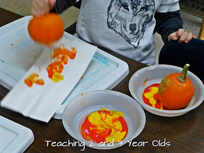 Painting with pumpkins from Teaching 2 and 3 year olds