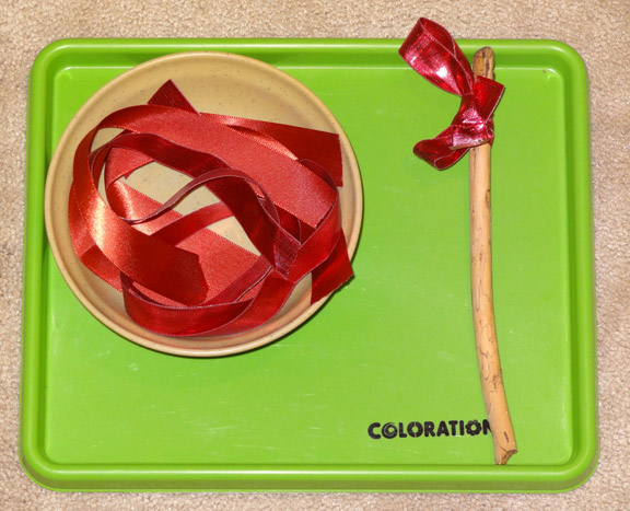 Montessori Christmas activities: Ribbon tying exercise || Gift of Curiosity