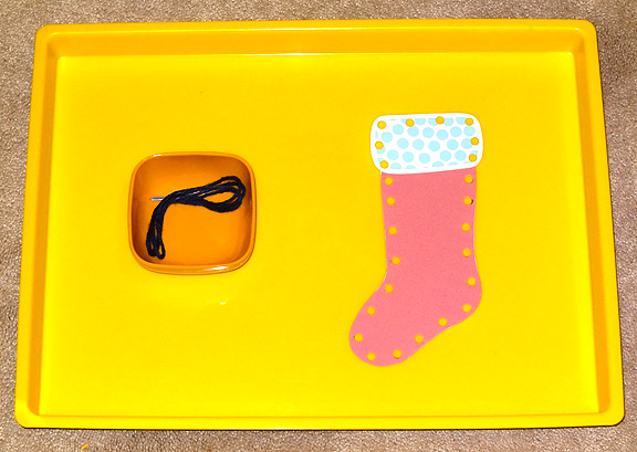 Montessori Christmas activities: Christmas stocking lacing activity || Gift of Curiosity