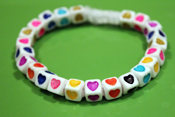 Valentine Montessori activities: String your own Valentine's bracelet || Gift of Curiosity