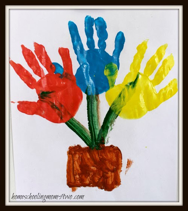 Spring flowers hand print art activity for preschoolers from Homeschooling Mom 4 Two