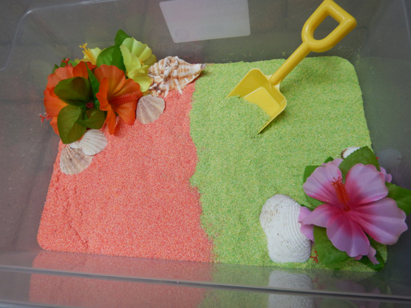 Edible summer luau sensory bin from Excite and Explore