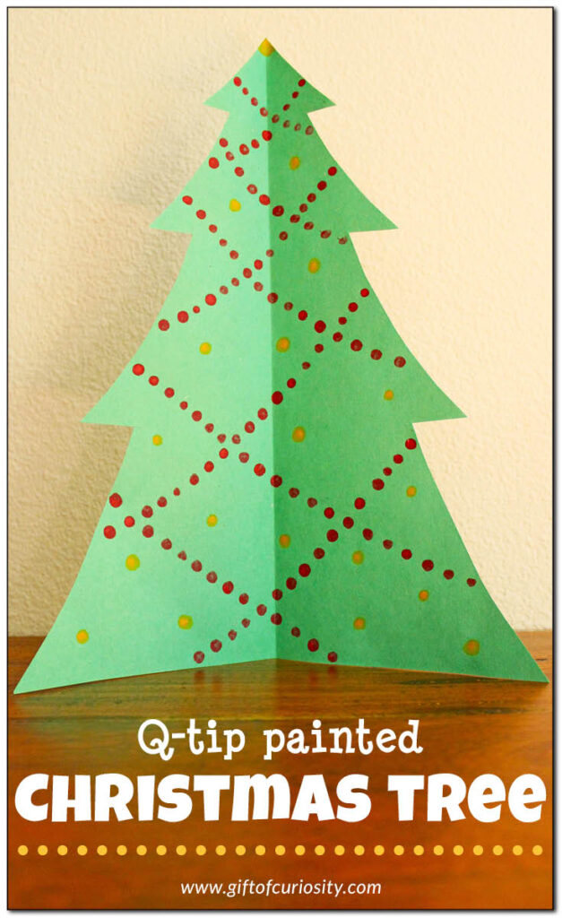 Q-tip painted Christmas tree. This is a great fine motor Christmas craft with such pretty results. These will be displayed in our living room at Christmas. || Gift of Curiosity