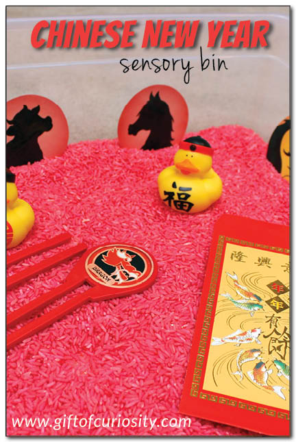 Chinese New Year sensory bin using dyed rice and Chinese-themed objects. What a fun idea for a Chinese New Year party for kids! || Gift of Curiosity