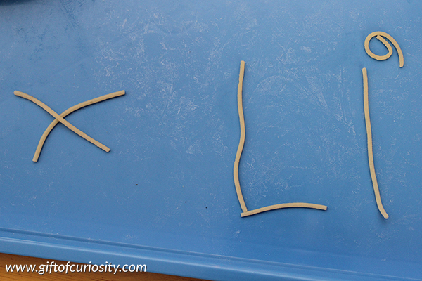 Use cooked spaghetti noodles to teach the alphabet. The post has info about how to keep the noodles from sticking. {101 Ways to Teach the Alphabet} || Gift of Curiosity