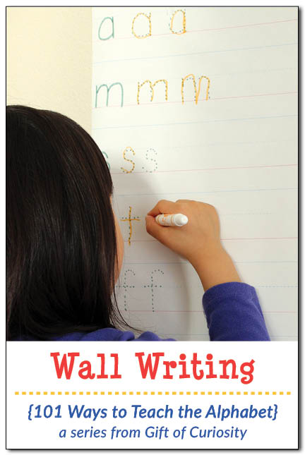 Wall writing: A great way for children to practice writing letters while also strengthening muscles in the shoulders, arms, and hands || Gift of Curiosity