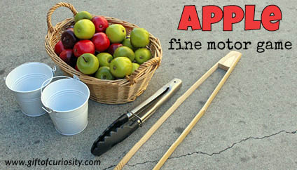 Apple fine motor game using tongs - Gift of Curiosity
