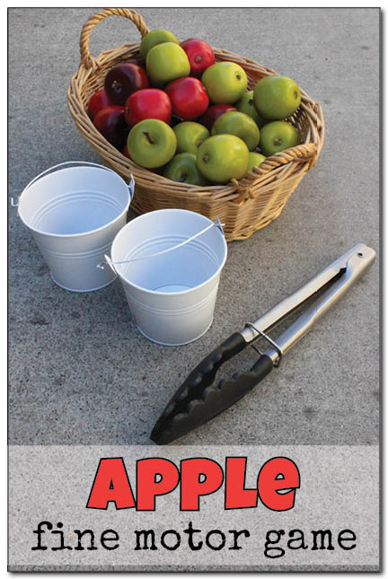 A fun apple fine motor game where kids must race to fill their apple pails as quickly as possible using only a pair of kitchen tongs! A great activity for a preschool apple unit. || Gift of Curiosity