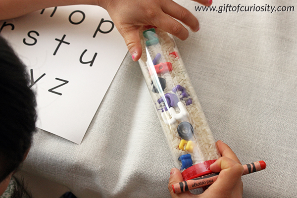 Fill a plastic tube with letter beads and rice, and you've got a perfect, no-mess I Spy Letter Hunt game for preschoolers! || Gift of Curiosity