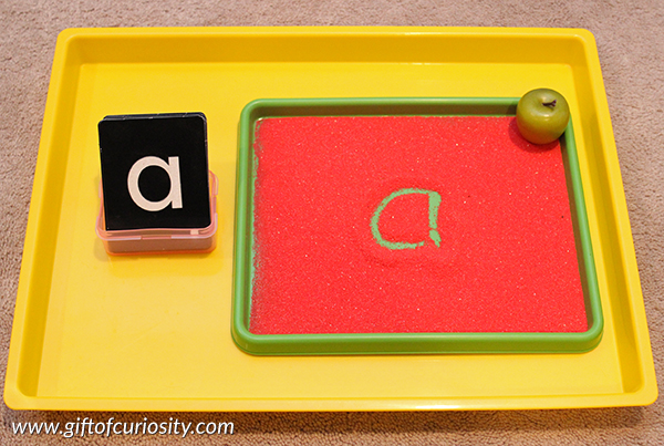 Apple letter writing Montessori tray: Part of a collection of apple-themed Montessori activity ideas for kids ages 2-5. || Gift of Curiosity