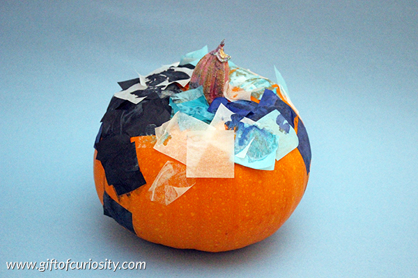 Tissue paper pumpkins - a beautiful (and kid-friendly!) way to decorate pumpkins for Halloween! || Gift of Curiosity