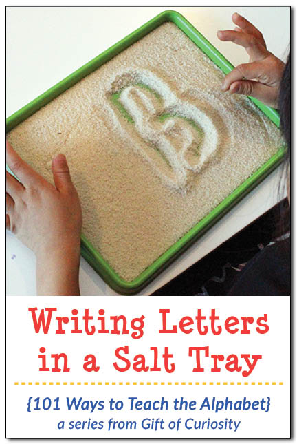 Writing letters in a salt tray is a Montessori-inspired, low-stress way for kids to practice correct letter formation. Find out why salt trays make it easy for kids to move on when they make a mistake. || Gift of Curiosity