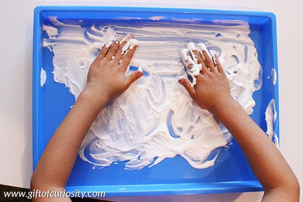 Shaving Cream Letters: Combine letter learning practice with sensory play by having kids learn to write letters in a tray filled with shaving cream! This activity has so many benefits for kids, especially making it easy to fix "mistakes." || Gift of Curiosity