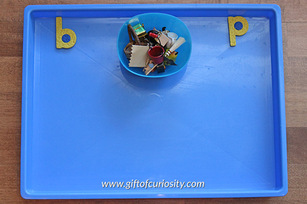 Sorting miniature objects by initial sound is a great way to help kids learn their letter sounds and learn to identify the initial sound of words. Part of the 101 Ways to Teach the Alphabet series from Gift of Curiosity