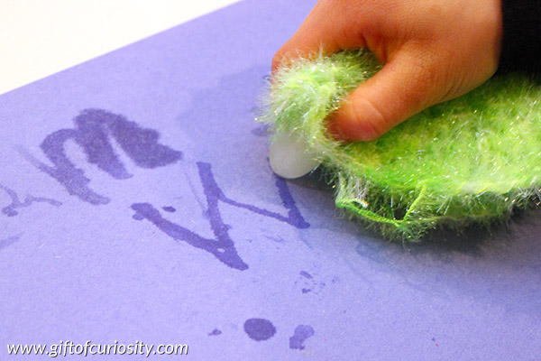 Icy letter writing is a cold sensory activity that also helps kids practice writing their alphabet. I've got to try this letter writing activity with my kids! || Gift of Curiosity