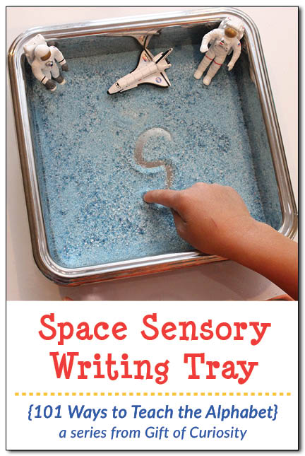Make this simple Space Sensory Writing Tray using colored salt and some space figurines. Great for practicing letters, numbers, and sight words! || Gift of Curiosity