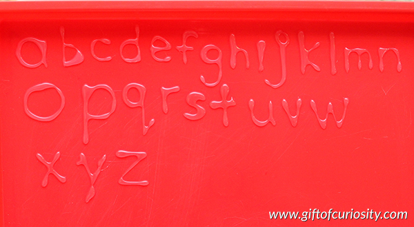 DIY Hot Glue Letters make a wonderful alphabet manipulative kids can play with. Plus, put them in a container of water and watch them float! What a fun idea for learning letters. || Gift of Curiosity