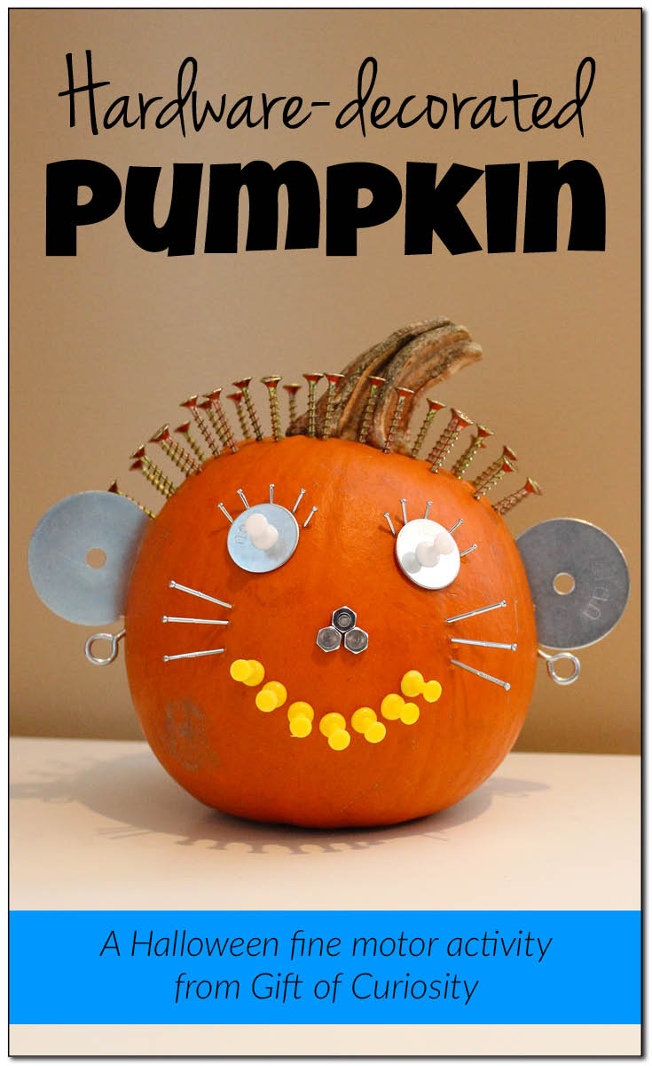 Hardware-decorated pumpkin make a great Halloween decoration, in addition to promoting the development of fine motor skills || Gift of Curiosity