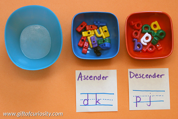 Sorting letters by their physical characteristics (e.g., ascenders vs. descenders) is a great way for young learners to attend to the shapes of letters {101 Ways to Teach the Alphabet} || Gift of Curiosity