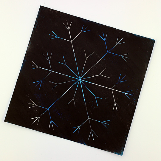 Snowflake scratch art using DIY scratch art paper - Gift of Curiosity