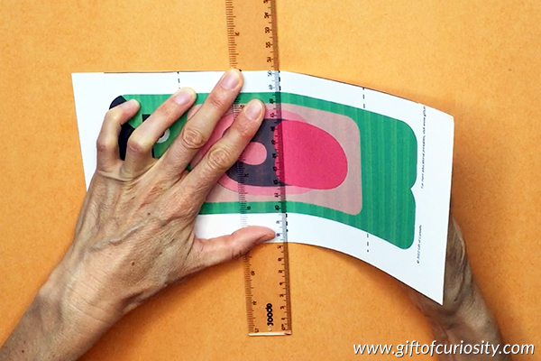 Use a ruler to fold the puppet along the 3 dotted lines. 